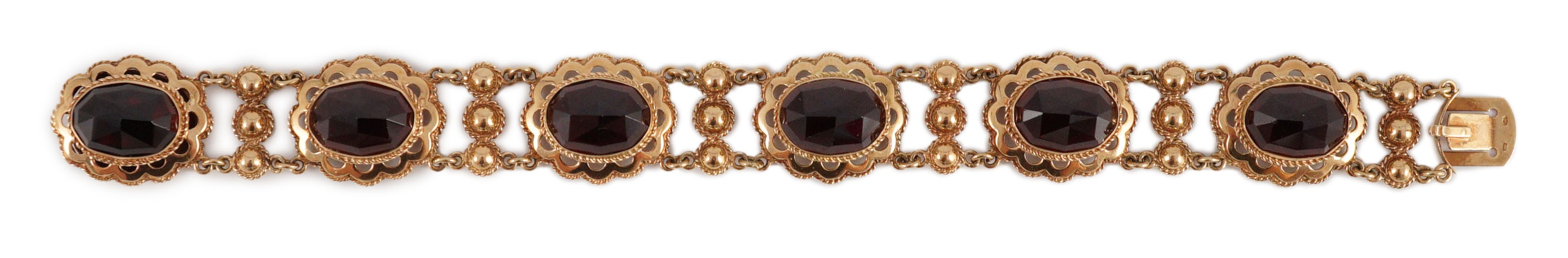 A 20th century Dutch 14k gold and six stone facet cut cabochon garnet set fancy link bracelet